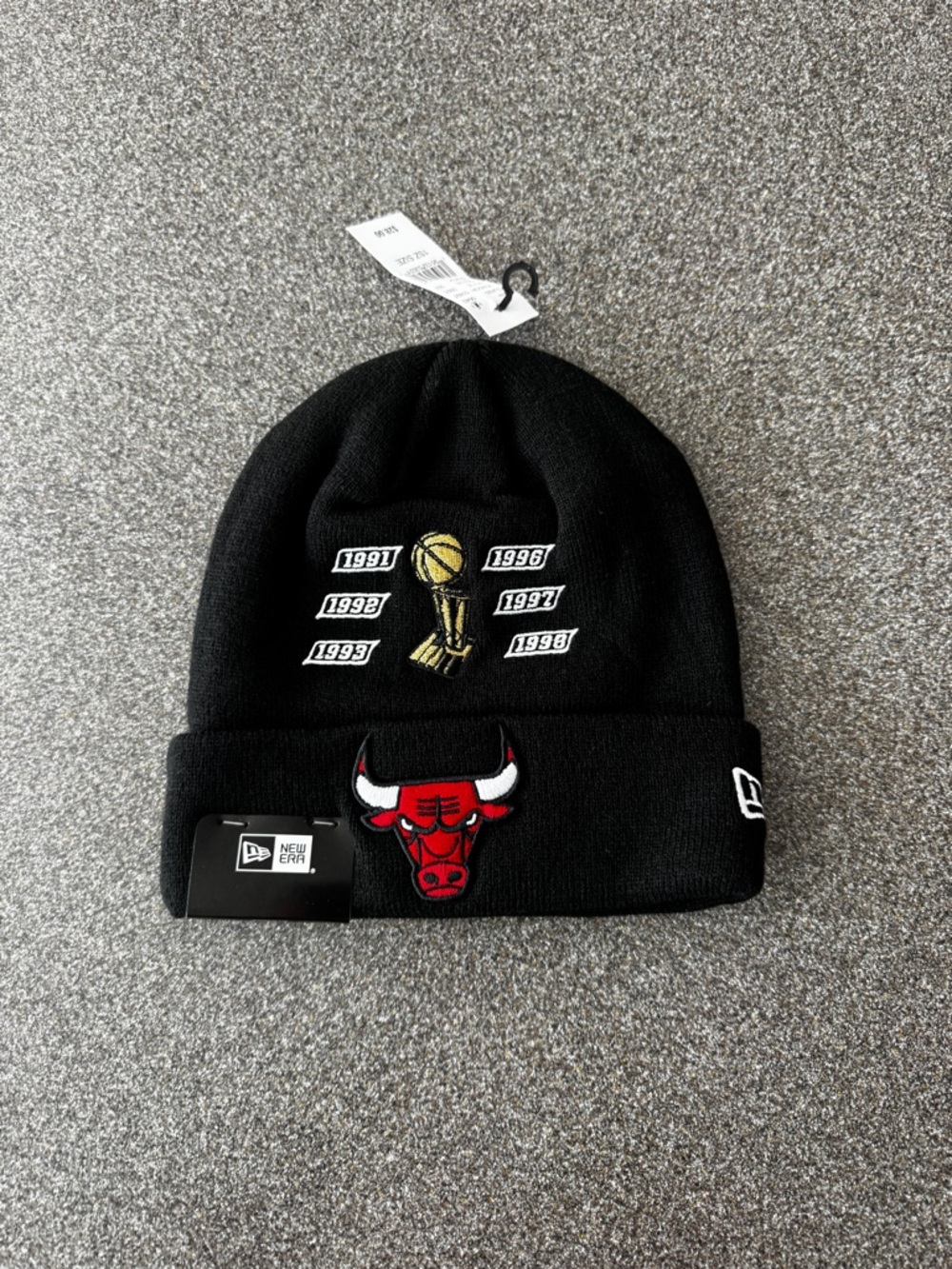 New Era Chicago Bulls Black Knit Beanie with Red Logo and Gold Trophy